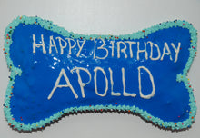 Load image into Gallery viewer, Bone cake made with peanut butter and banana and blue frosting.